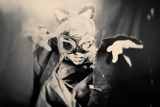 black and white portrait of a child in bed with his eyes open. the child is afraid of the bogeyman