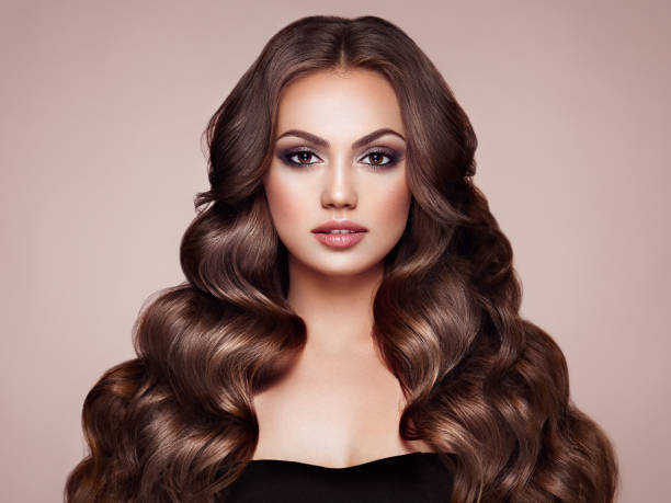 istock Brunette woman with curly hair 993595758