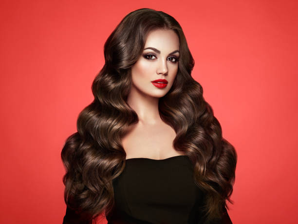 istock Brunette woman with curly hair 993595924