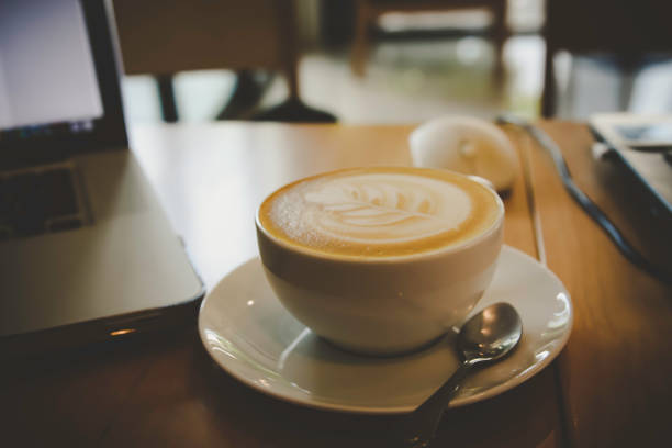 istock coffee cup on a wood table in the morning 993597006