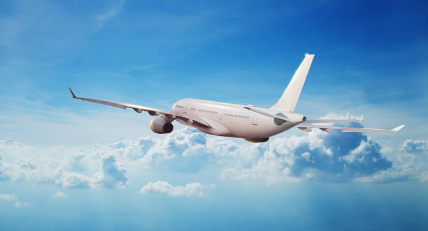 istock Commercial airplane jetliner flying above clouds 993597616