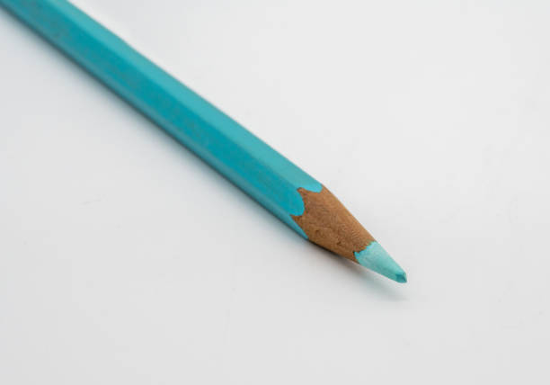 istock Light blue color pencil isolated on white background. Selective focus 993607928
