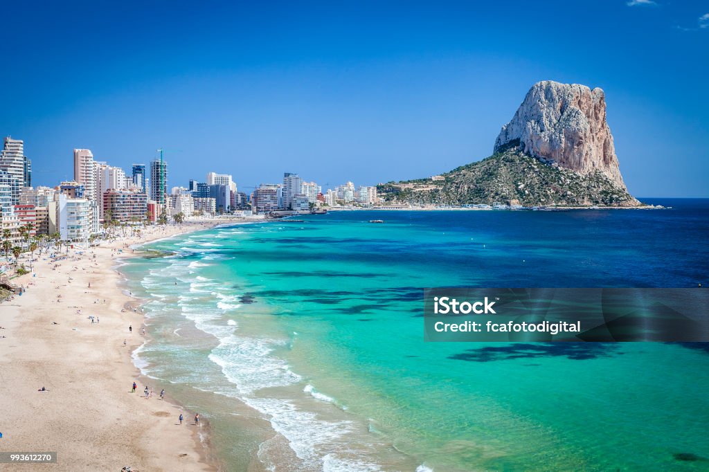 Peñon de Ifach, Calpe-Autonomous Community of Valencia, Spain Calpe beach with Peñon de Ifach at background. Comunidad Autonoma de Valencia, Spain. Canon EOS 5D Mk II and Canon EF 17-40mm f/4L IS USM Wide Angle Zoom Lens. Alicante Province Stock Photo