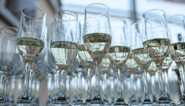 istock A large number of half full champagne or bubbly flutes 993615982