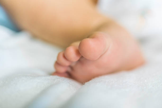 istock Baby's feet are on the couch. 993617488