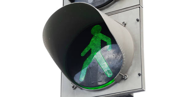istock Green pedestrian traffic light isolated 993617678