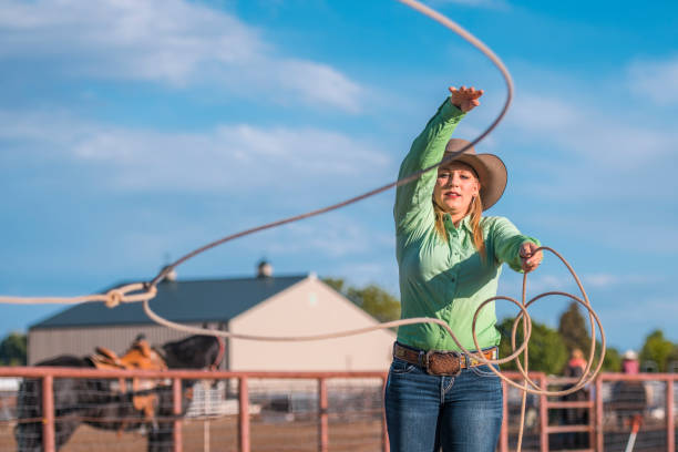 istock Cowgirl training lassoing on a ranch 993630524