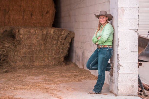istock Cowgirl posing on a ranch 993630678