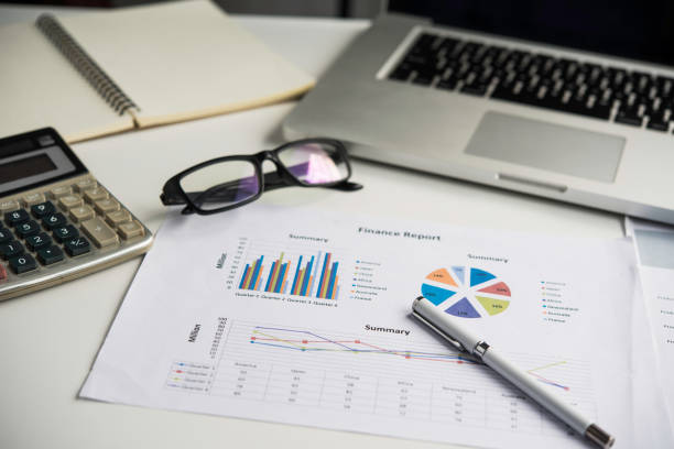 istock Top view with document Book Pen Graph laptop And accounting documents placed on the desk in office 993631824