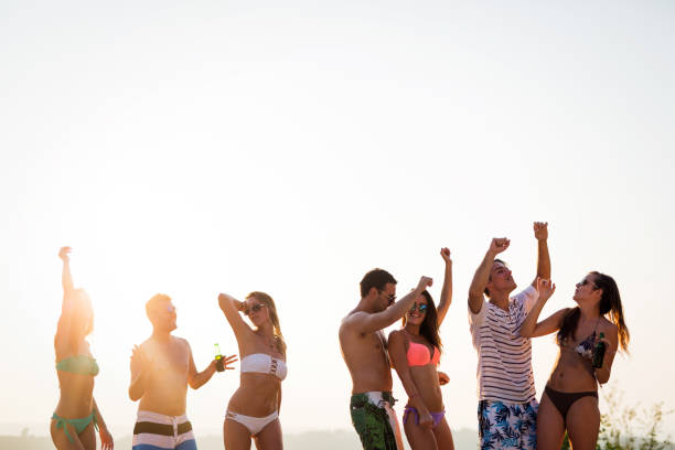 istock Friends partying during summer vacation 993639176
