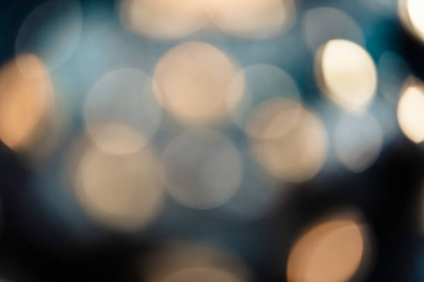 istock Abstract bokeh background of light bulb 993639410