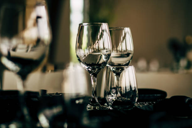 istock Luxury table settings for fine dining with and glassware, beautiful blurred  background. For events, weddings. WEDDINGS, Wedding detals and planing. 993643870