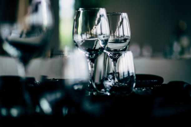 istock Luxury table settings for fine dining with and glassware, beautiful blurred  background. For events, weddings. WEDDINGS, Wedding detals and planing. 993643886
