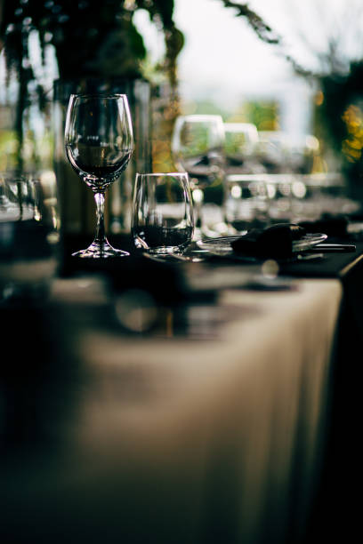 istock Luxury table settings for fine dining with and glassware, beautiful blurred  background. For events, weddings. WEDDINGS, Wedding detals and planing. 993643982