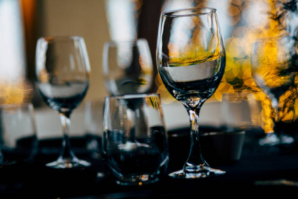 istock Luxury table settings for fine dining with and glassware, beautiful blurred  background. For events, weddings. WEDDINGS, Wedding detals and planing. 993644698