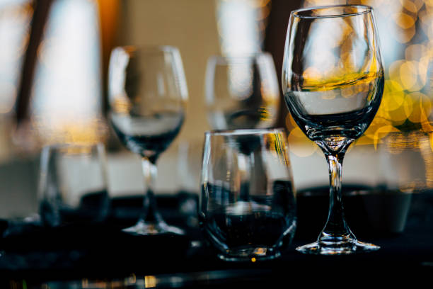 istock Luxury table settings for fine dining with and glassware, beautiful blurred  background. For events, weddings. WEDDINGS, Wedding detals and planing. 993645050
