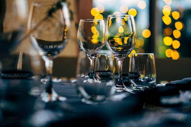 istock Luxury table settings for fine dining with and glassware, beautiful blurred  background. For events, weddings. WEDDINGS, Wedding detals and planing. 993647194