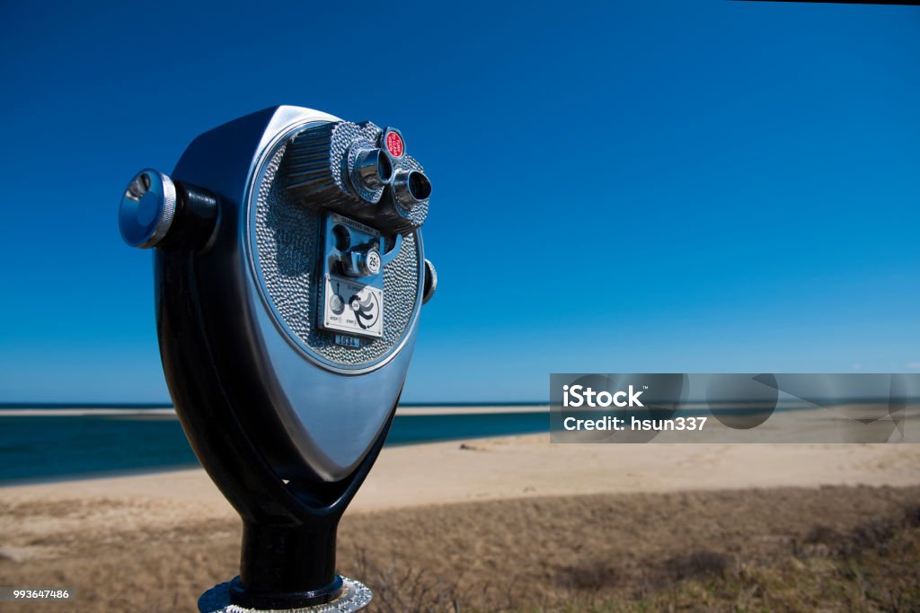 Binoculars by the Chatham Lighthouse Beach Binoculars by the Chatham Lighthouse Beach with ocean view as a backdrop Binoculars Stock Photo