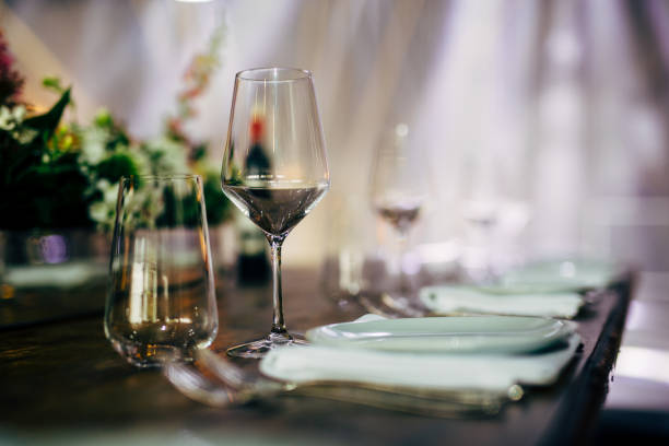 istock Luxury table settings for fine dining with and glassware, beautiful blurred  background. For events, weddings. WEDDINGS, Wedding detals and planing. 993647852