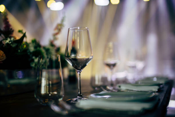 istock Luxury table settings for fine dining with and glassware, beautiful blurred  background. For events, weddings. WEDDINGS, Wedding detals and planing. 993647858