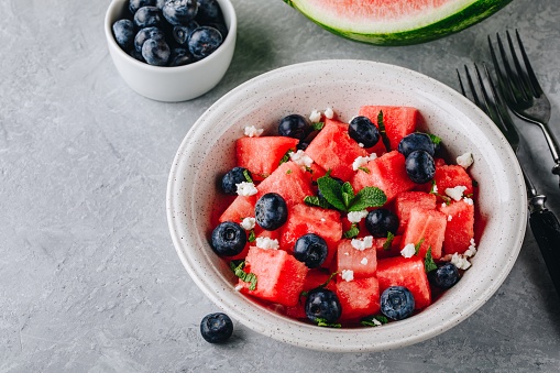 Summer fruit salad with watermelon, blueberries, feta cheese and mint.