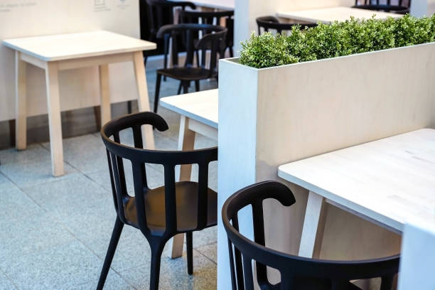 istock Fresh green grass grows in a concrete pot. 993658020