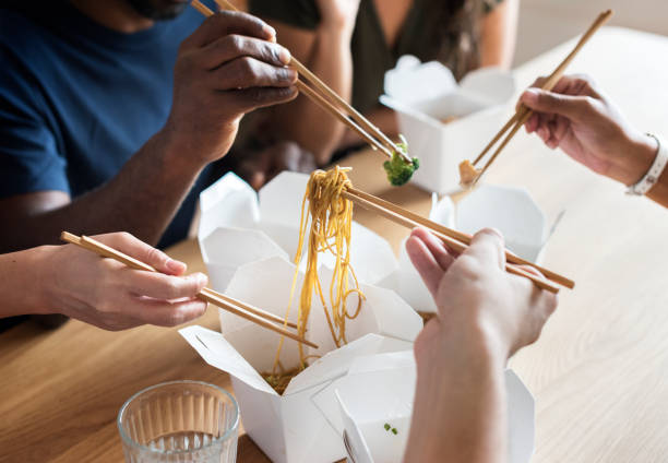 istock Friends eating Chow mein together 993671934