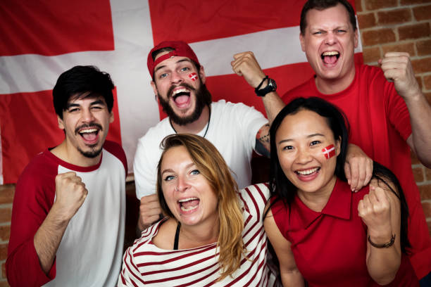 istock Friends cheering world cup with painted flag 993672384