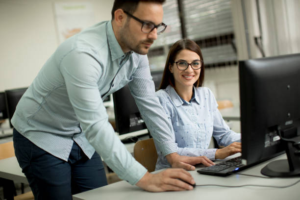 istock Young couple in the classroom 993680756