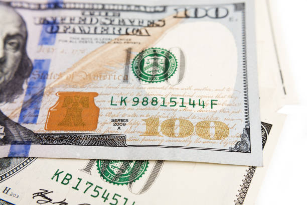 istock One hundred dollars close up with a portrait, selective focus 993684220