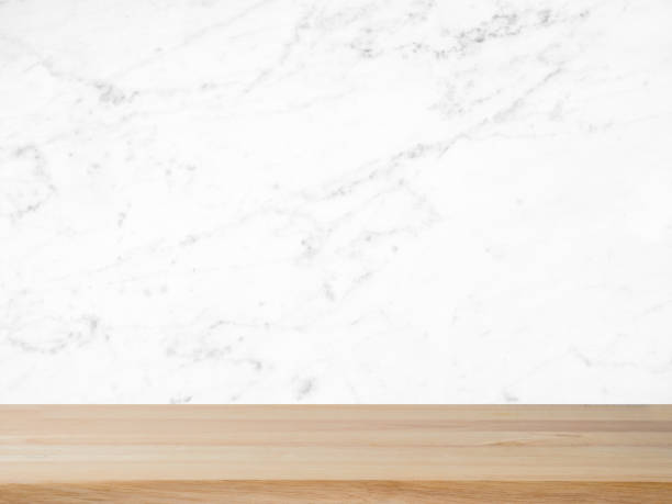istock Natural wood table texture on white marble background. texture for add text. use for product display. 993686916