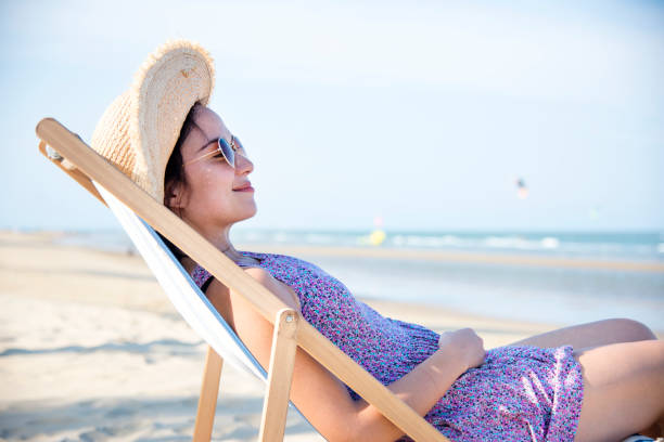 istock Woman chilling on the beach 993687012