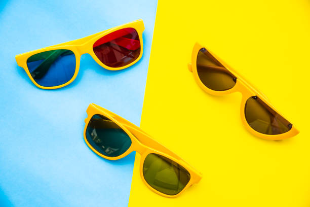 istock Top view for sunglasses on a colorful background. 993688842