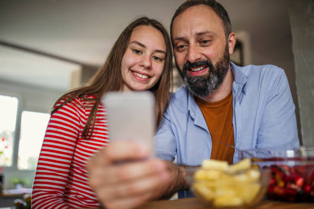 istock Father and daughter enjoying at home 993691448