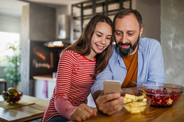 Father and daughter enjoying at home