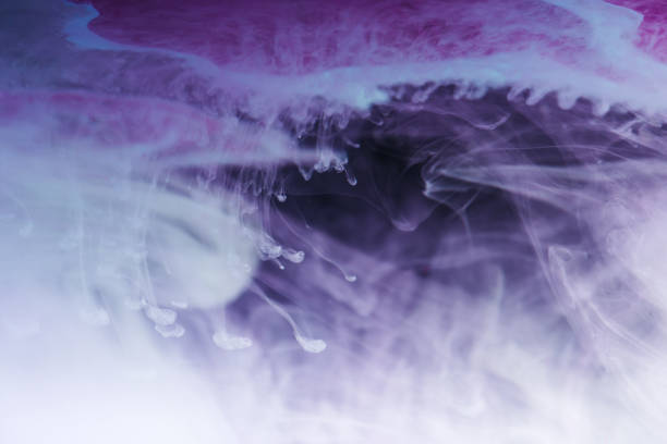 istock abstract blue, white and purple artistic background with flowing ink 993702270
