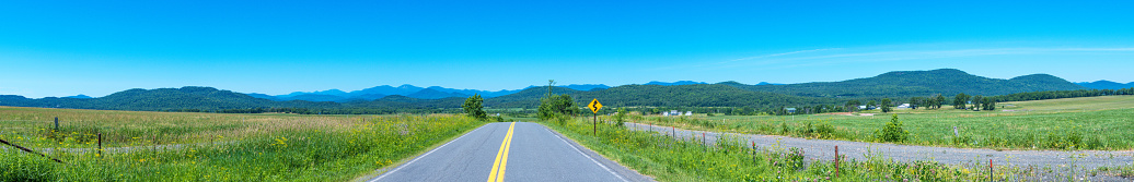 A less-traveled road winds through the foothills of the Blue Ridge Mountains in western Virginia.