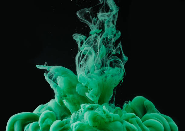 istock close-up view of green ink explosion on black background 993706078