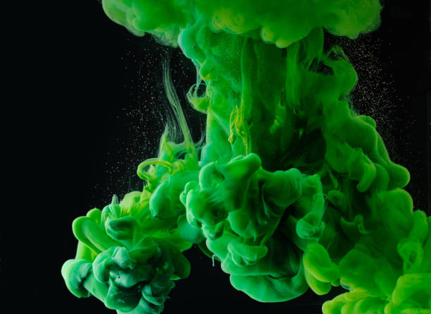 istock close-up view of green abstract paint explosion on black background 993706652