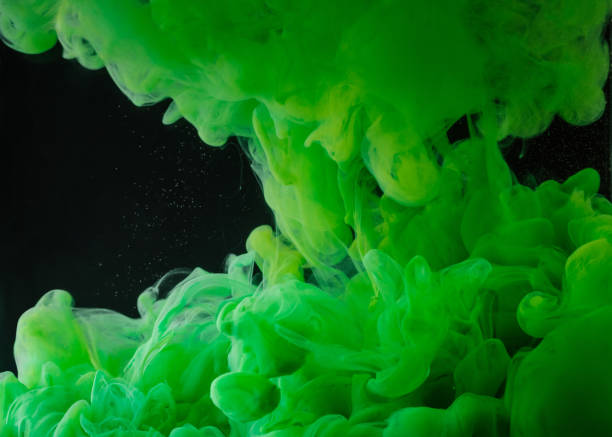 istock close-up view of bright green abstract paint on black background 993706832