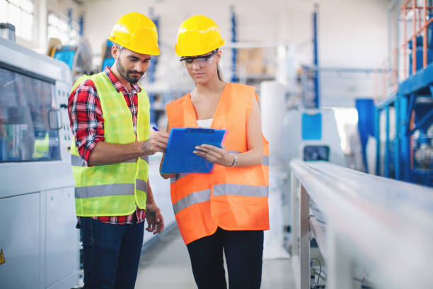 istock Workers in modern pvc factory at work 993706956