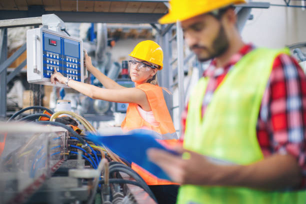 istock Workers in modern pvc factory at work 993707412