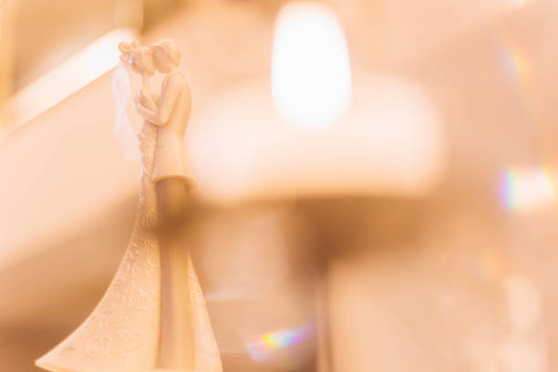 Top of cake on table decorated in wedding party