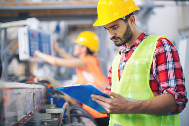 istock Workers in modern pvc factory at work 993711834