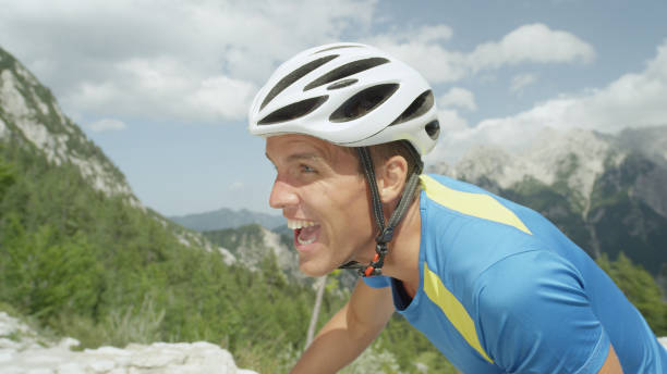 istock CLOSE UP: Athletic man going through grueling exhaustion during cycling tour. 993718756