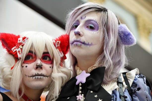 Moscow, Russia - June 29, 2018: Two girl participants in sugar skull makeup during Dia de los Muertos Mexican carnival. Day of The Dead