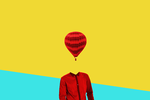 Surrealistic minimal concept. A balloon instead of a human head. Minimalism and surrealism.