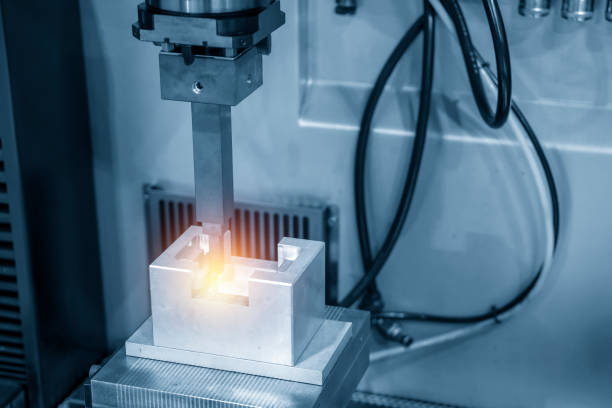 istock The EDM,Electric Discharge Machine  with the copper electrode. 993730548