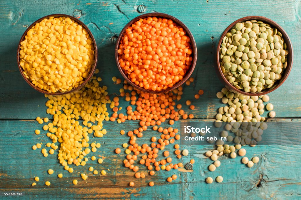 Red yellow green lentils high angle view Lentil Stock Photo