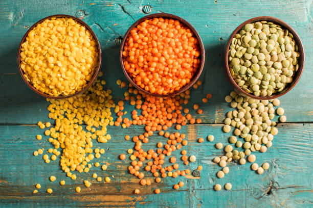 red yellow green lentils high angle view - lentil imagens e fotografias de stock